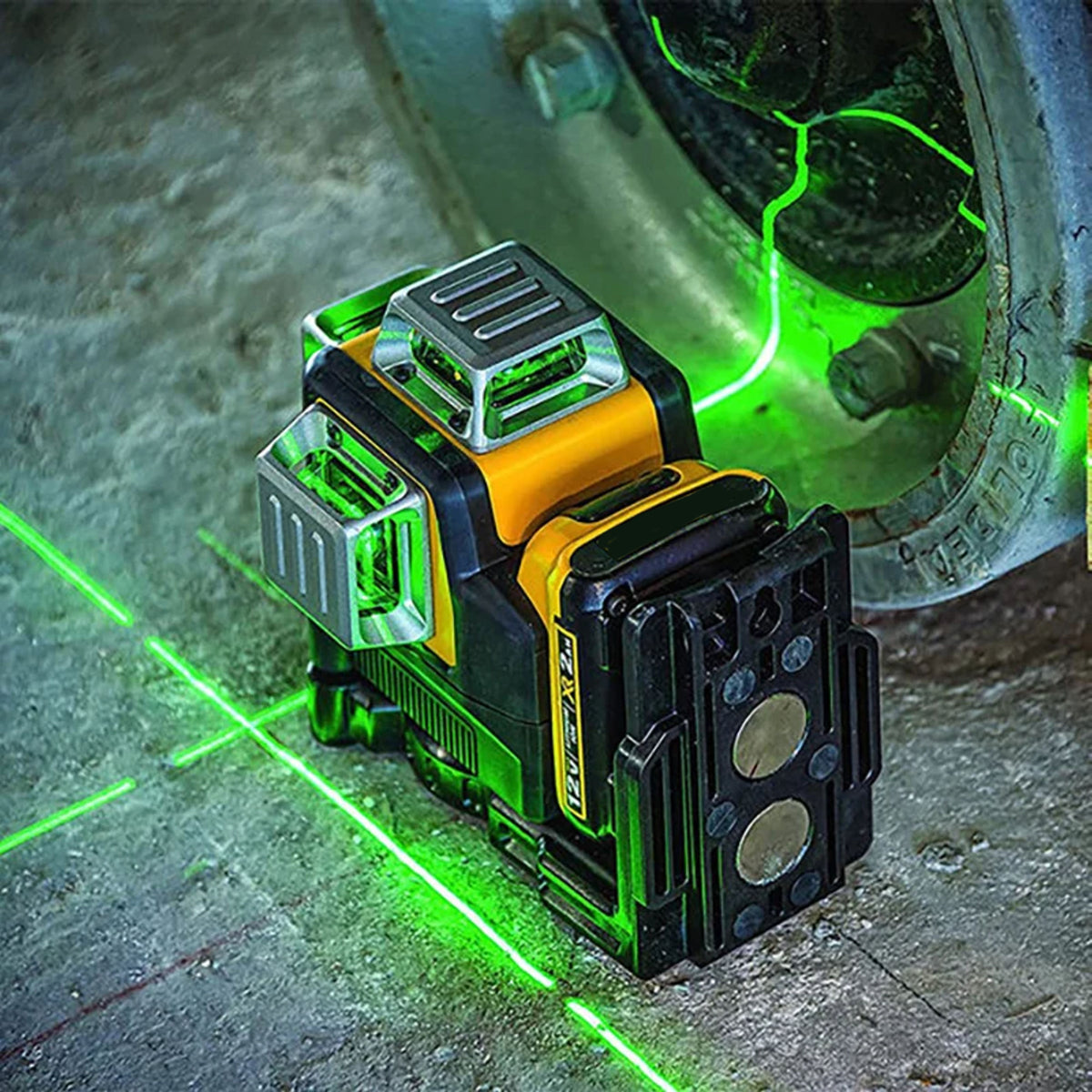 Al&Afa green laser level on a site floor beside a pipe