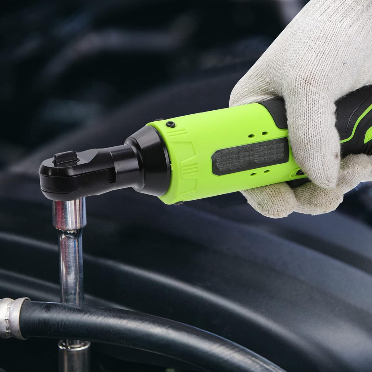 Cordless ratchet driving a socket in an engine bay